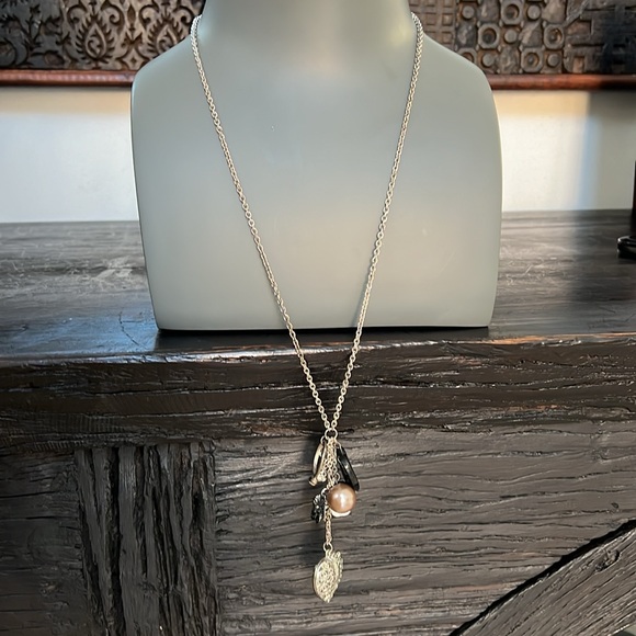 Long silver toned necklace with 8 charms in black and silver heart bead ring - Picture 7 of 9